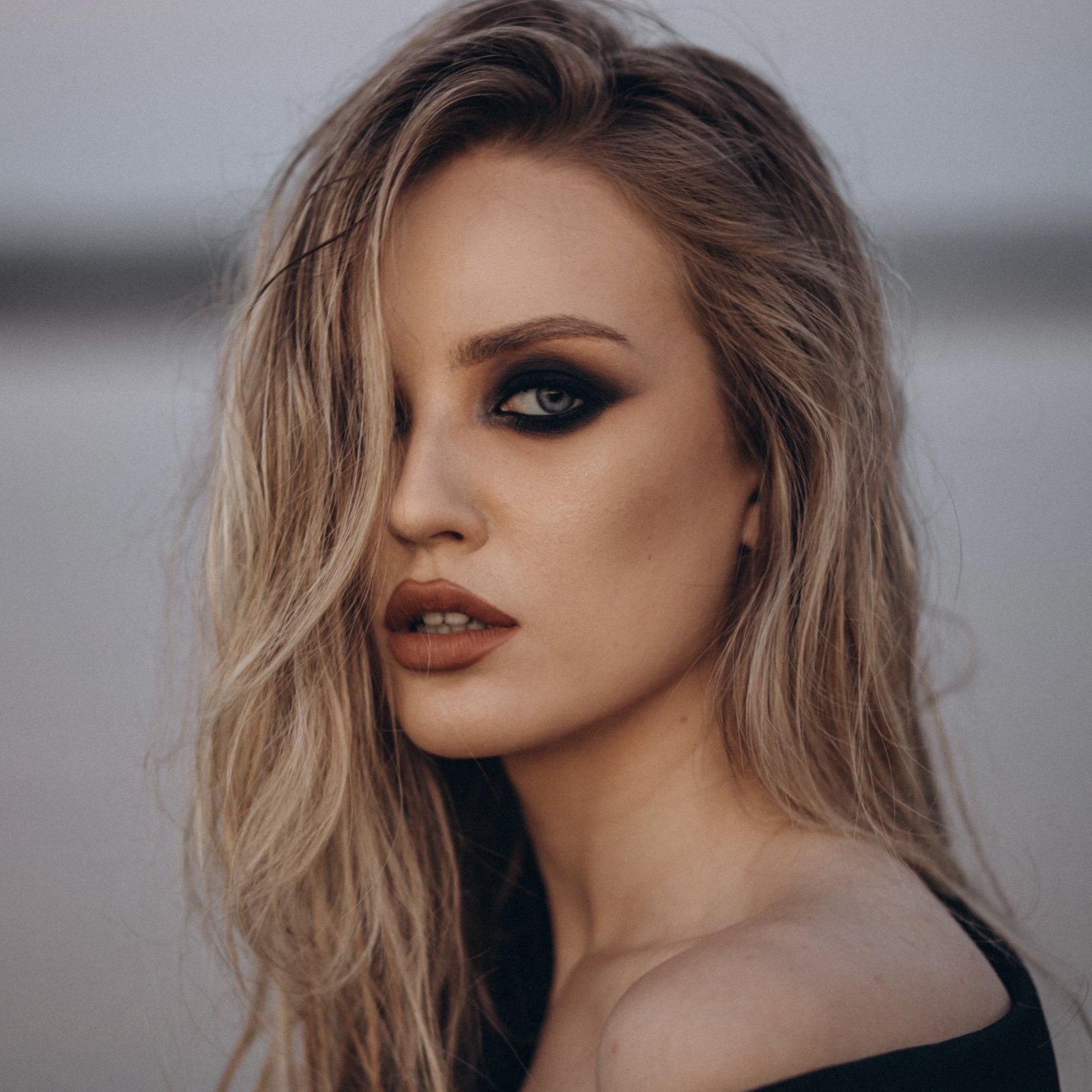 Smoky eye glam makeup with tousled waves by a Melbourne makeup artist